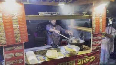 street food vendor cooking delicious dishes