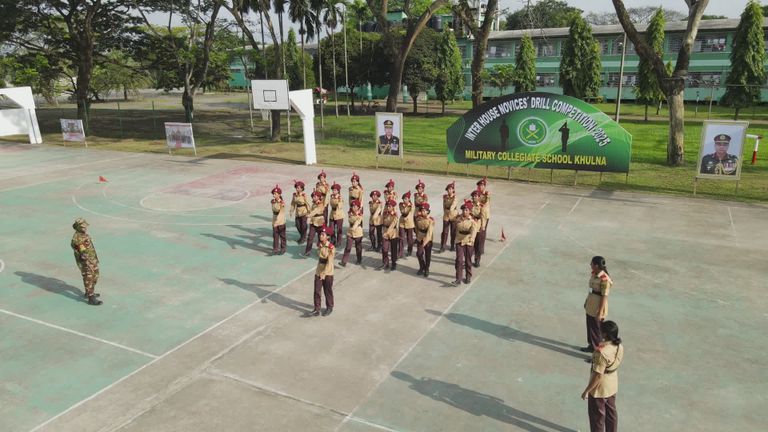 Cadets running a drill together on an outdoor court