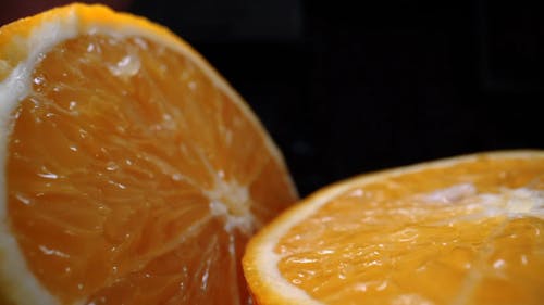 An Orange Fruit Cut In Half