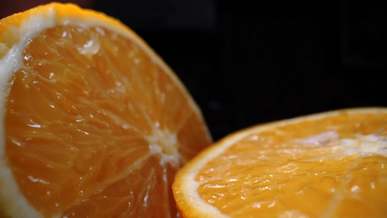 an orange fruit cut in half