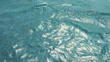 serene water surface with sunlight reflections