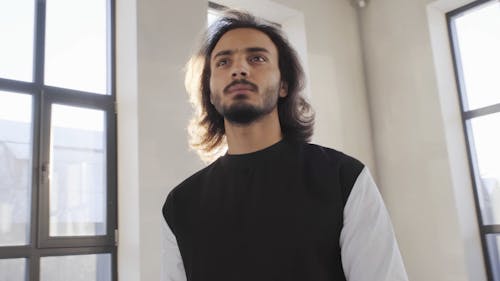 Man Inside A Building With Ray Of Sunlight Passing Through The Room