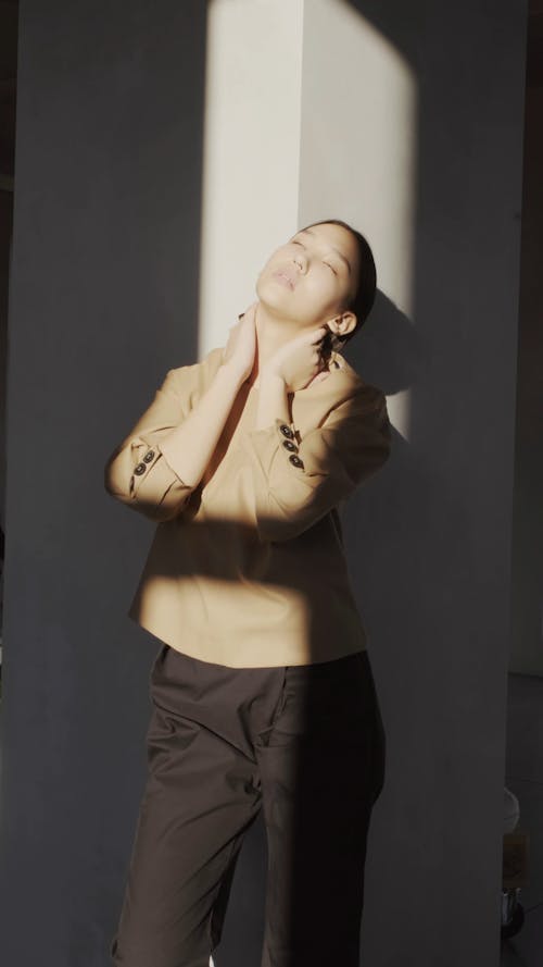 Woman In Brown Blazer Enjoying The Sunlight