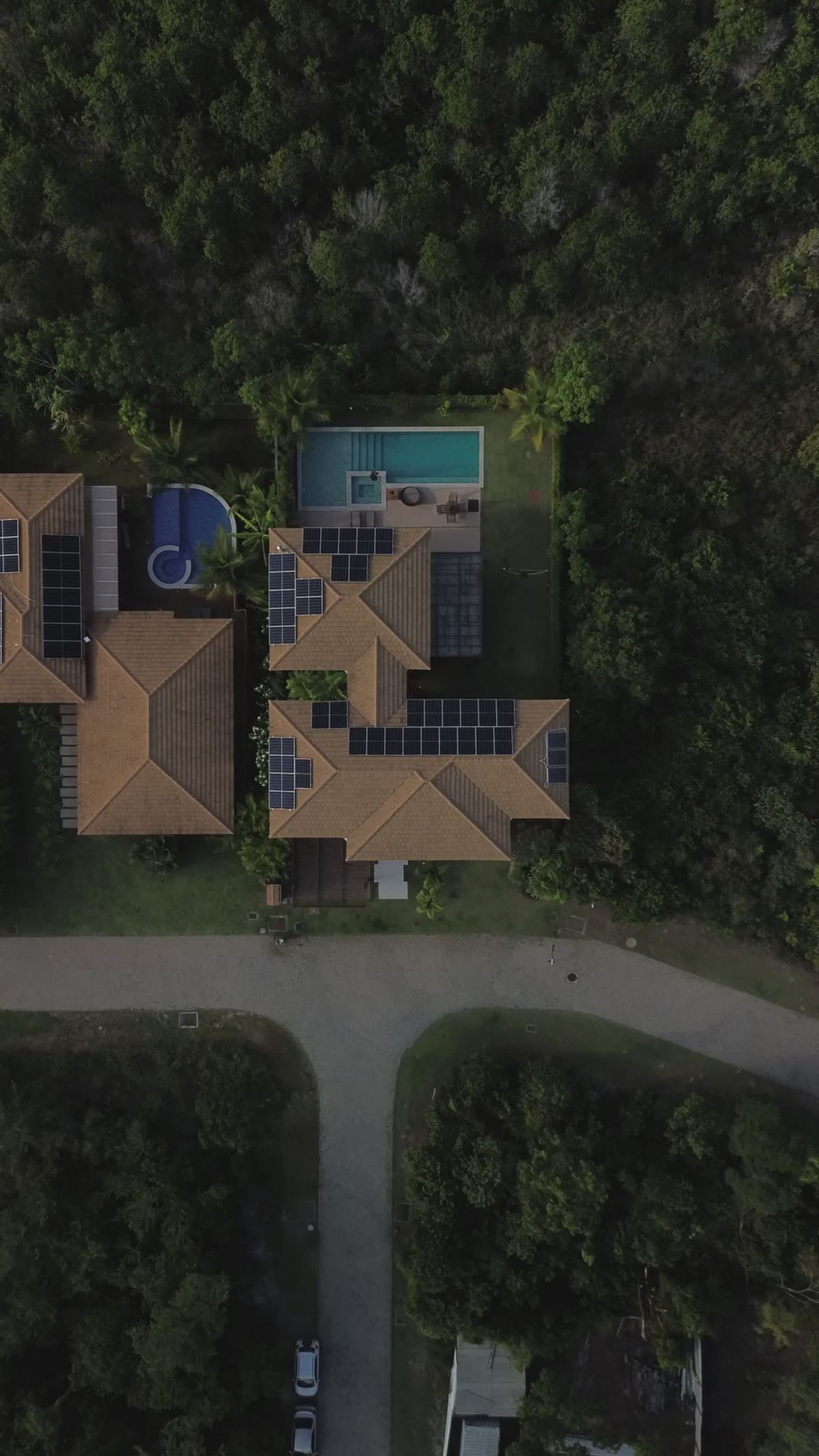Aerial view of premium home construction and backyard pool project