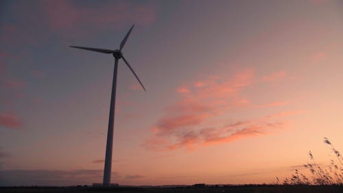 A Windmill In Operation For Renewable Energy Production