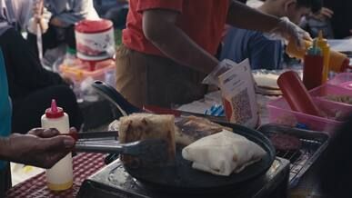 authentic street food cooking in vibrant market