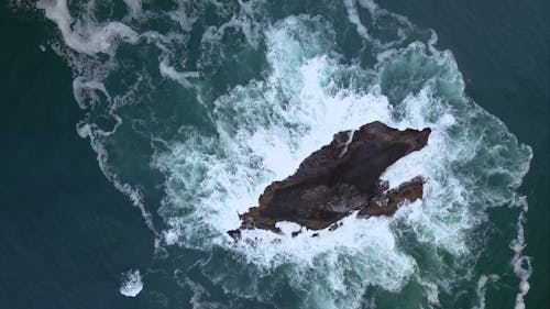 Top View Footage Of The Rock In The Middle Of The Sea