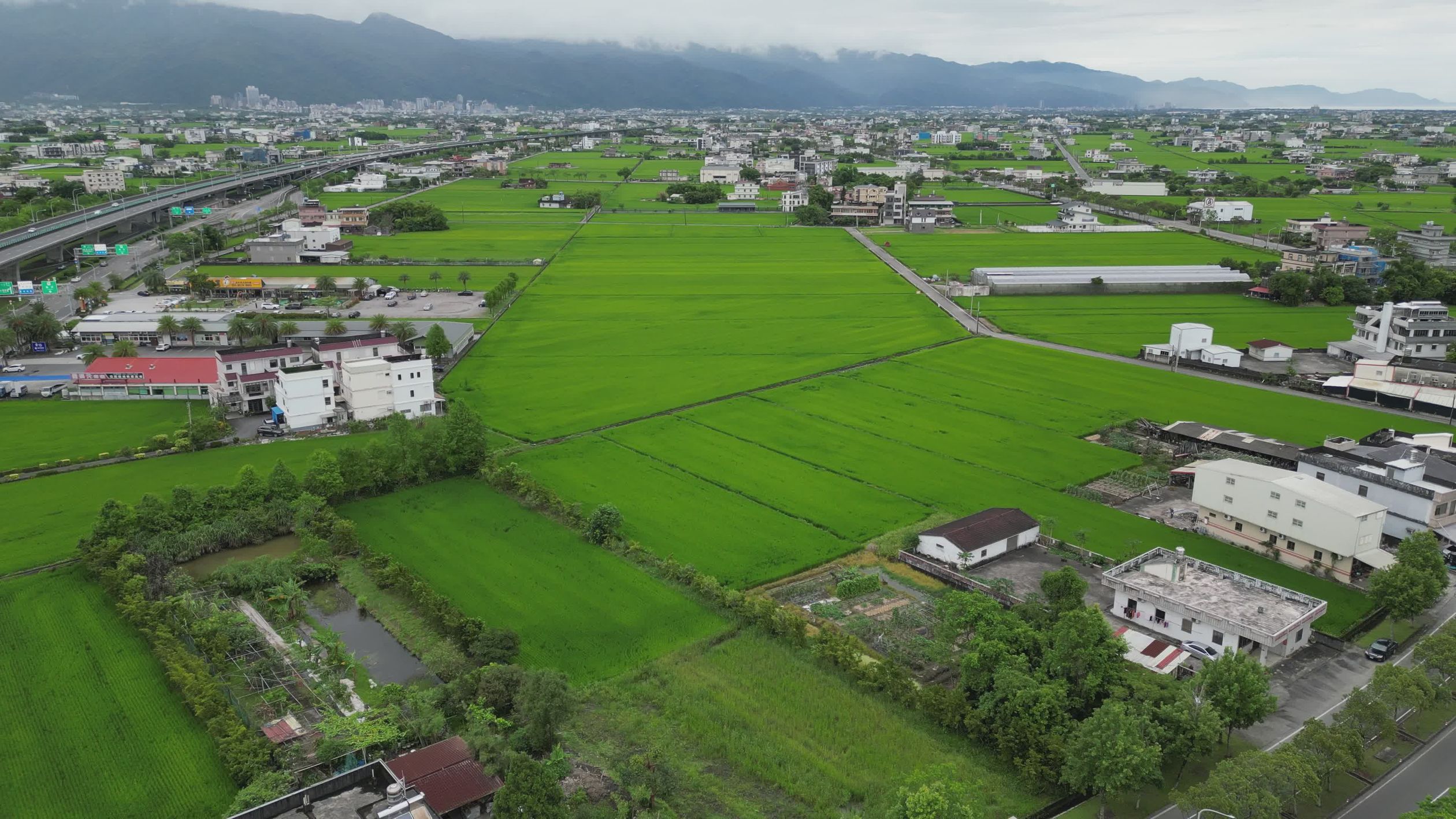 Lush Green Fields Aerial View with Mountains Free Stock Video Footage ...