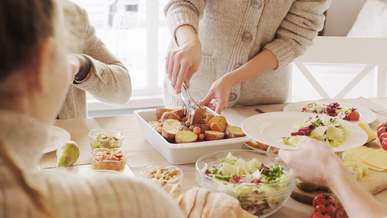 woman serving food for the group