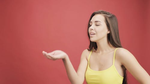 Footage Of A Woman Blowing A Confetti