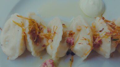 delicious dumplings with sauce on plate
