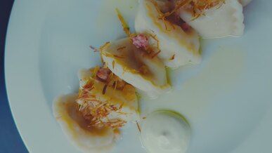close up of gourmet dumplings with toppings