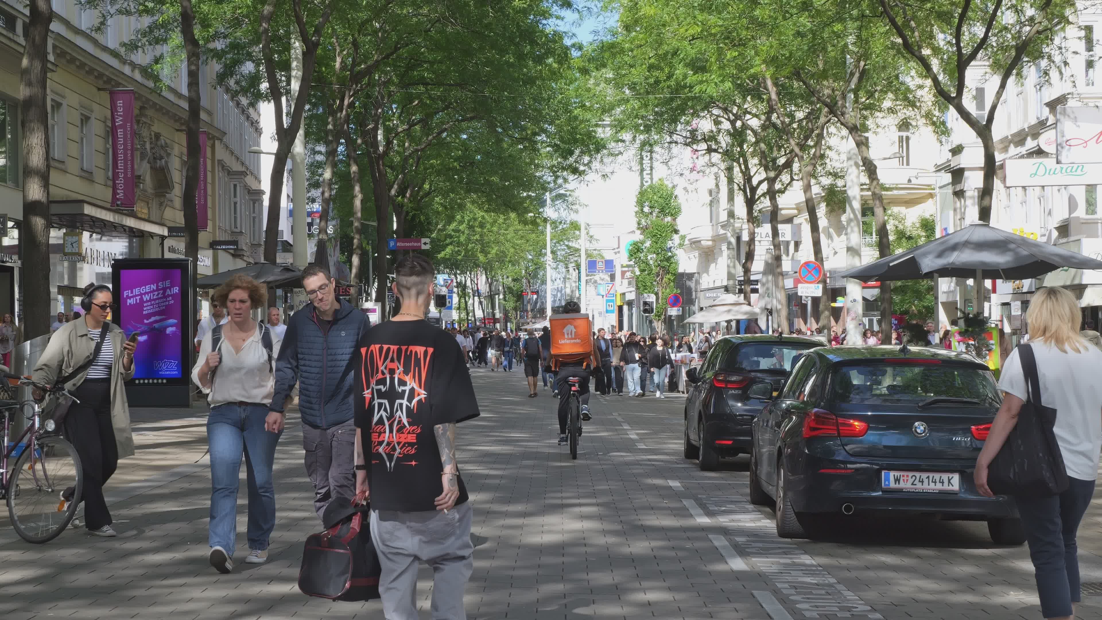 Bustling City Street with Pedestrians and Cyclists Free Stock Video ...