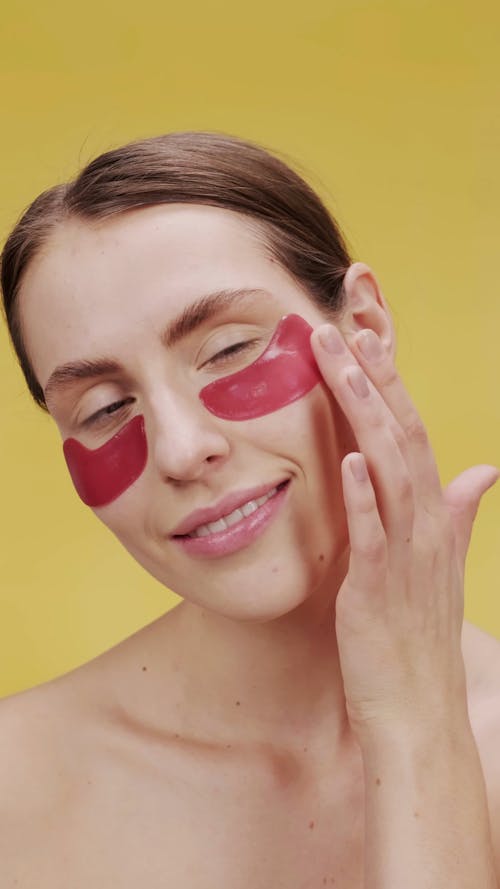 Woman Removing The Under Eye Mask