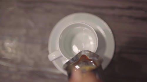 Footage Of A Person Pouring Coffee In The Mug