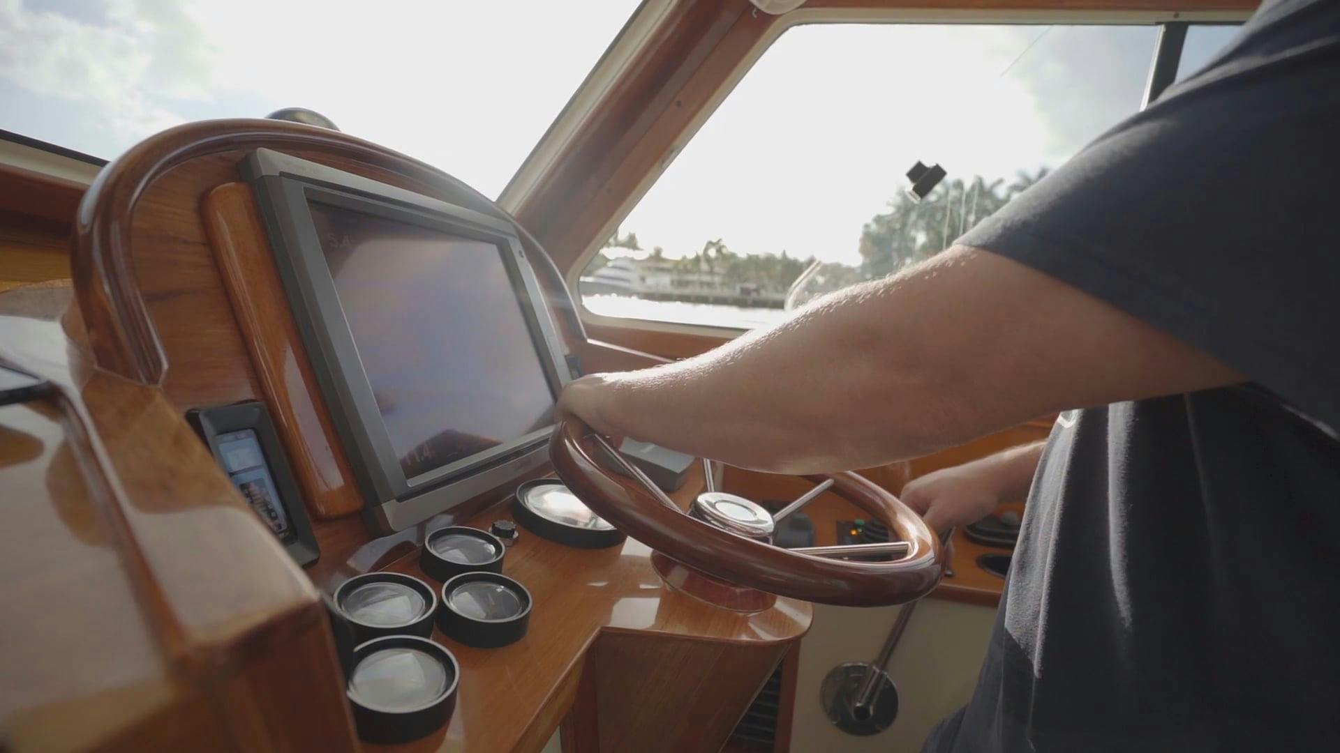 A Boat Captain On The Steering Wheel Inside The Cabin · Free Stock Video