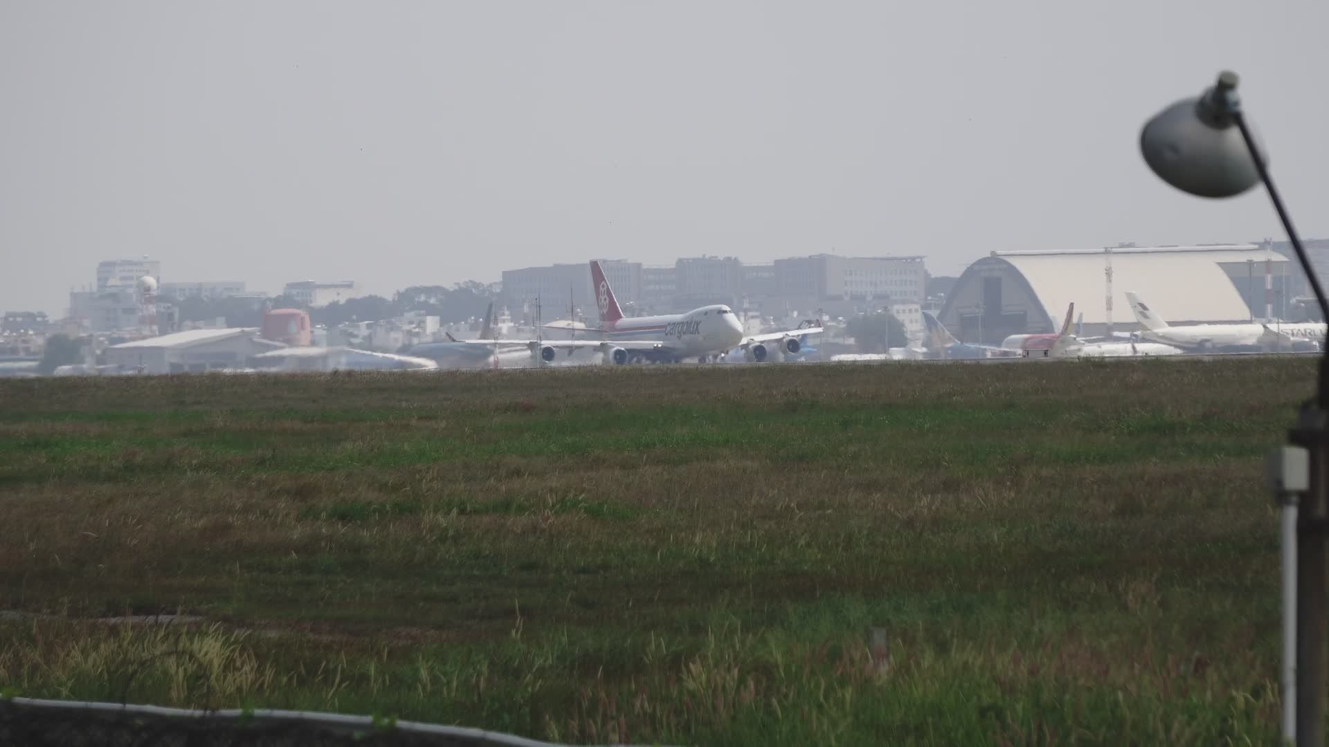 Cargo airplane taking off from an airport runway