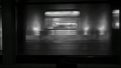 A Subway Train Leaving A Station