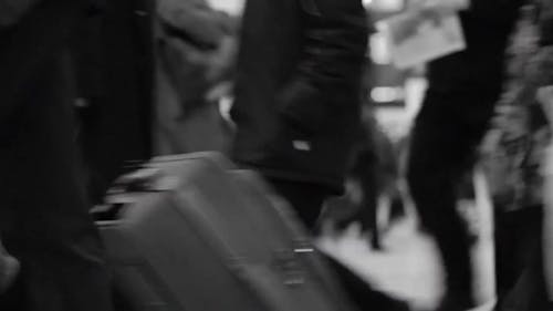 A Blurry Video of People Walking in an Airport Terminal