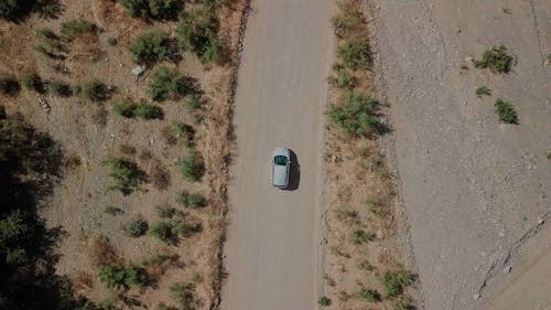 Tracking A Car Travelling On A Road In Wilderness