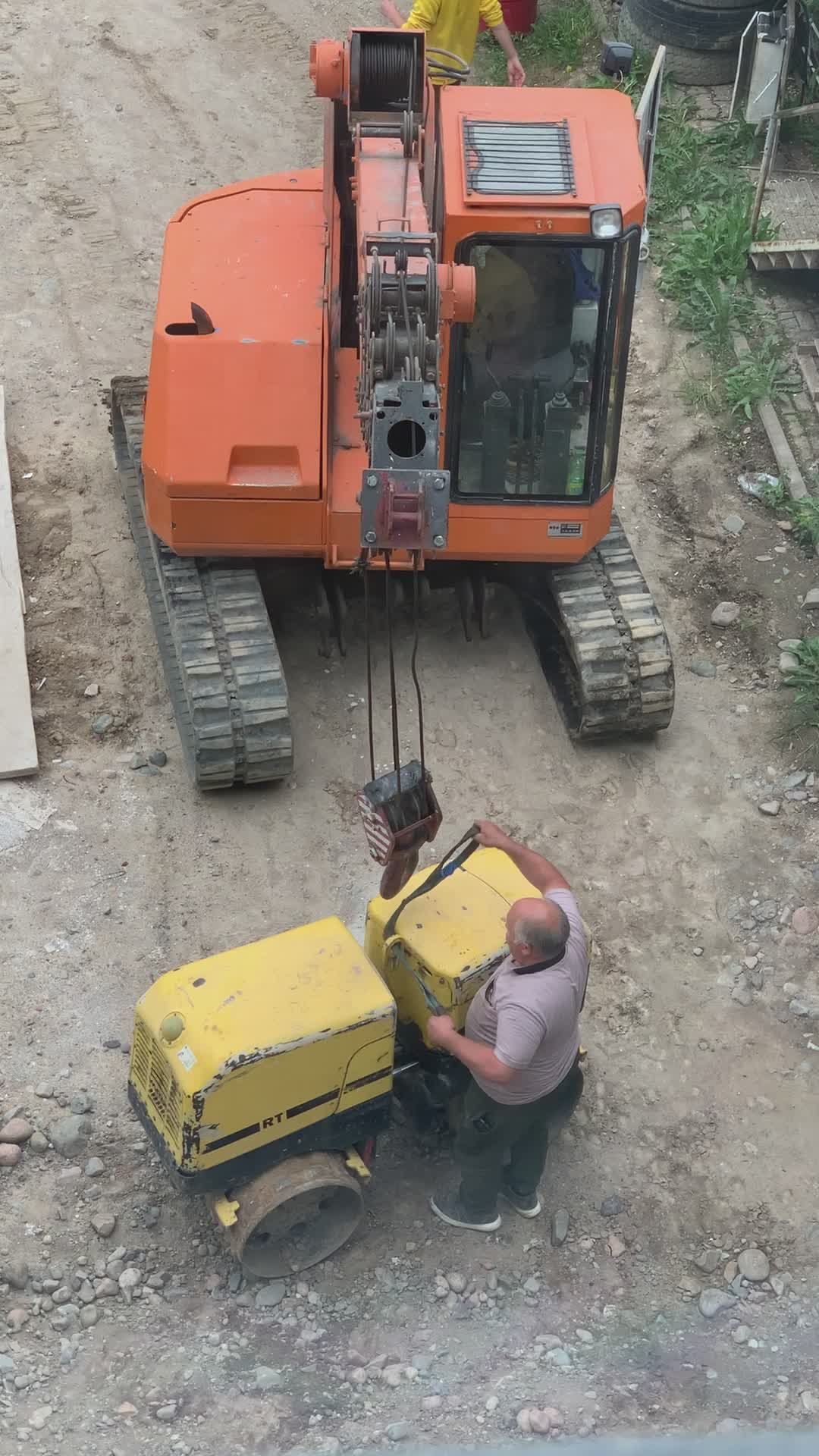 Excavator Lifting Heavy Equipment at Construction Site Free Stock Video ...