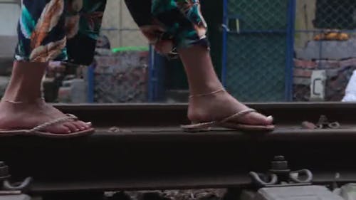 Person Walking On A Railway