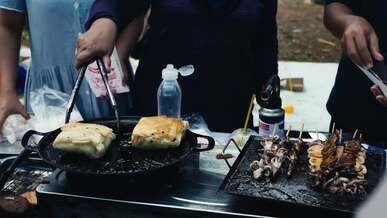 street vendor cooking traditional indonesian dishes