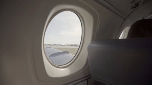 View Of The Airport Field From An Airplane's Window