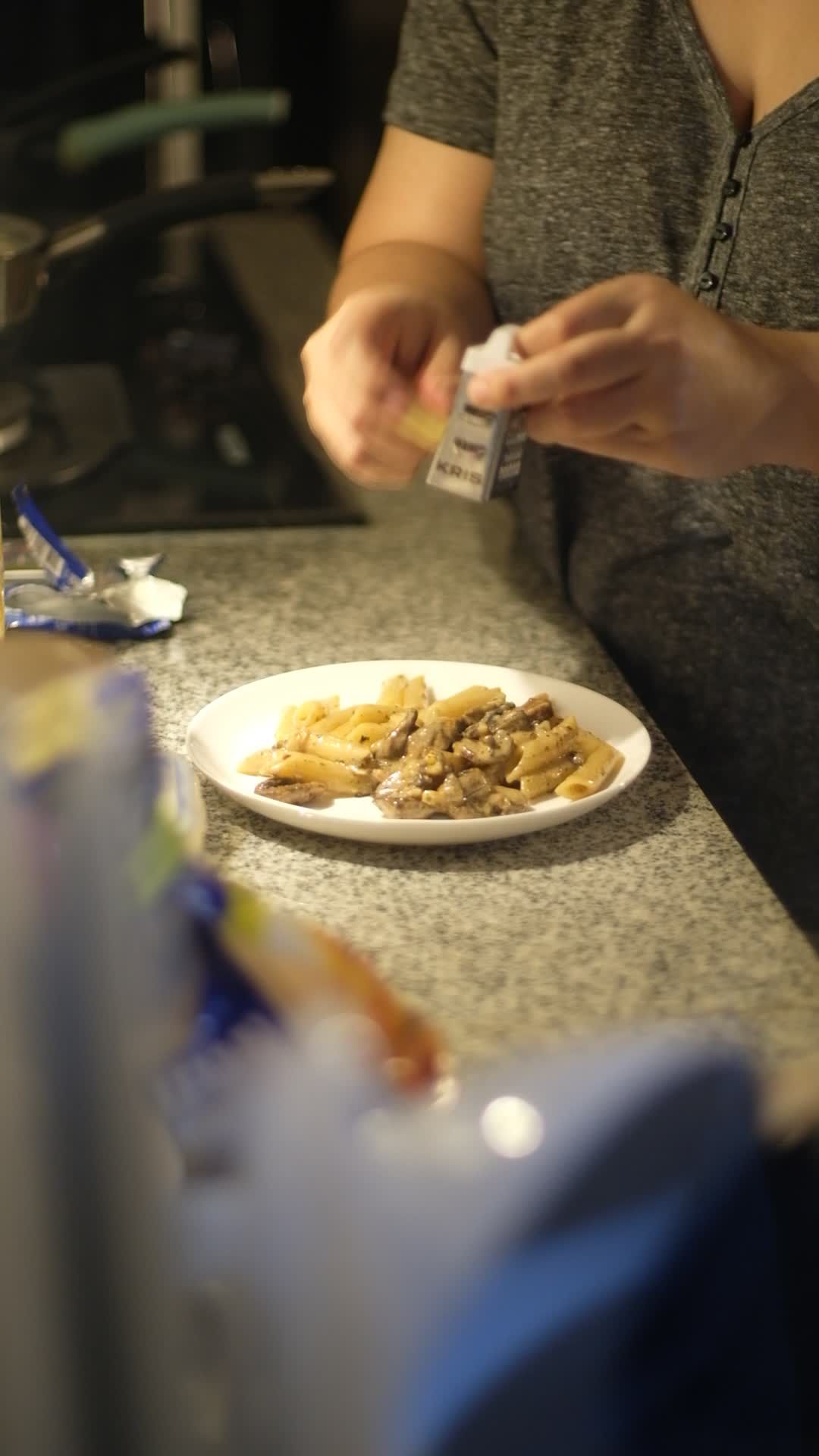 artisan home cooking adding flavor to a pasta dish 37876492