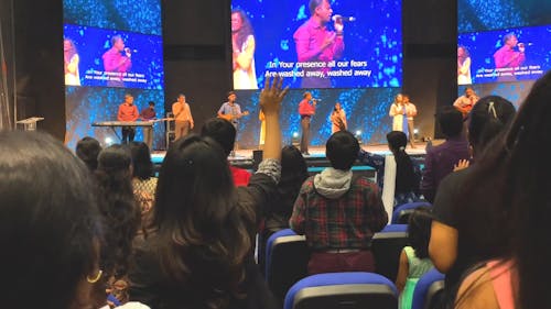 Group Of People In A Prayer Meeting To Worship