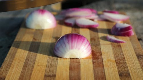 Footage Of Someone Cutting An Onion