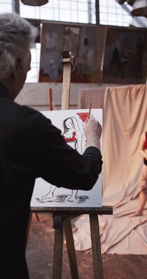A Woman Disrobing To Start The Art Session · Free Stock Video