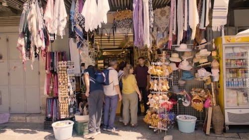 Tourist Buying Souvenirs From A Souvenir Shop
