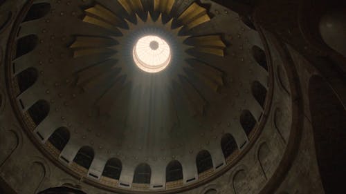 Sunlight Passing Through A Dome Ceiling Of A Cathedral