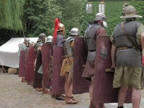 roman legionaries marching in formation outdoors