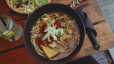 delicious vegan ramen bowl on rustic table