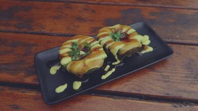 gourmet sushi donuts on wooden table