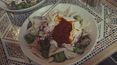 delicious turkish manti dish on mosaic table