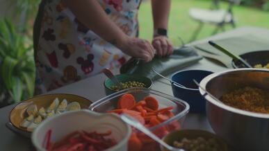 preparing homemade tamales in outdoor kitchen