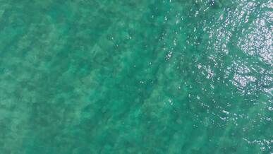 aerial view of sparkling turquoise sea