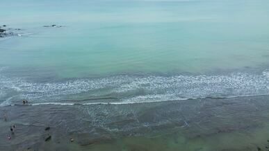 scenic aerial view of tranquil beach waves