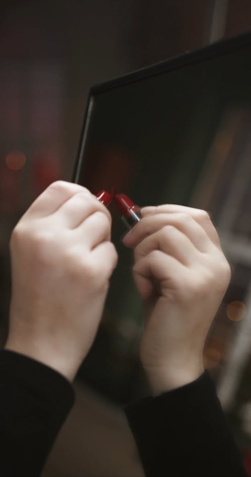 Using A Lipstick On Writing Over A Mirror