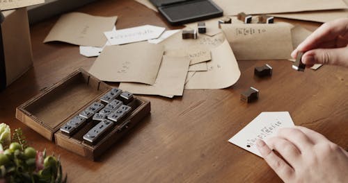 Using Letter Rubber Stamps On A Paper Card For Greetings 