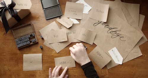 Stamping Letters On A Paper To Convey A Message