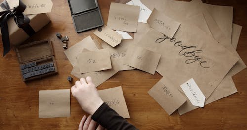 Stamping Letters On A Paper To Convey An Apology