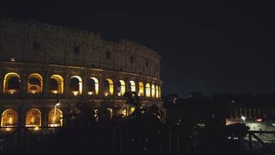 nighttime view of rome s illuminated colosseum
