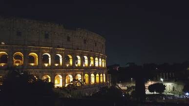stunning night view of the colosseum in rome