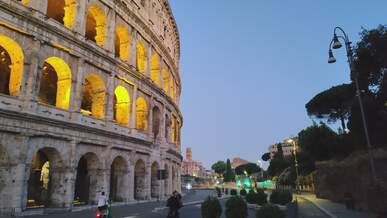 twilight view of the illuminated colosseum