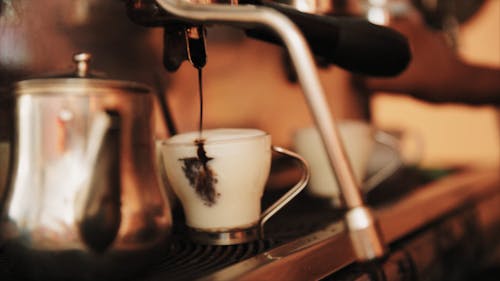 A Person Preparing a Coffee