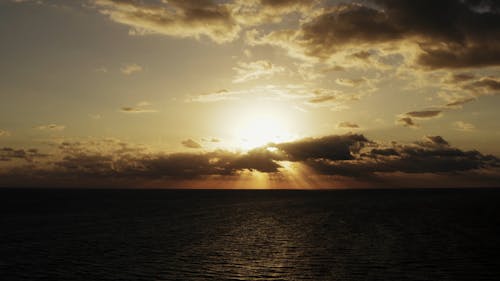 View Of Sunrise Over A Body Of Water